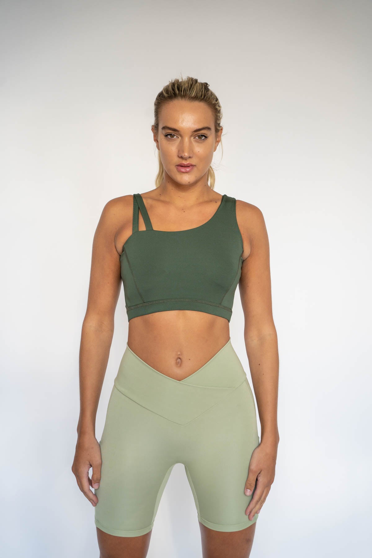 finesseactive.co Blue mix match Dione Crossover Biker Shorts x Evia  Asymmetrical Sports Bra Finesse Active is a sustainable activewear f