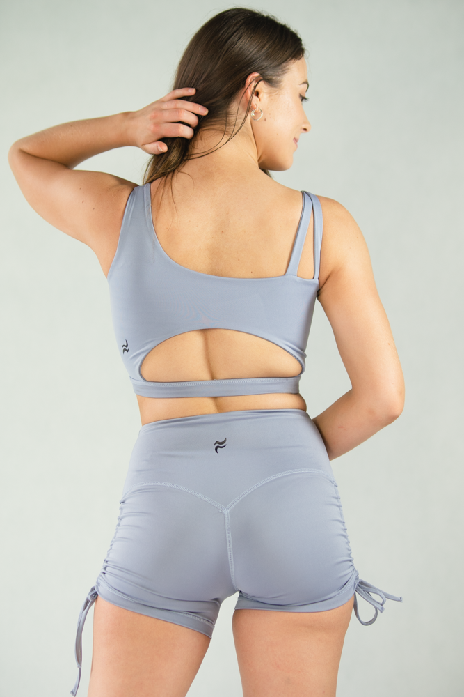 finesseactive.co Blue mix match Dione Crossover Biker Shorts x Evia  Asymmetrical Sports Bra Finesse Active is a sustainable activewear f
